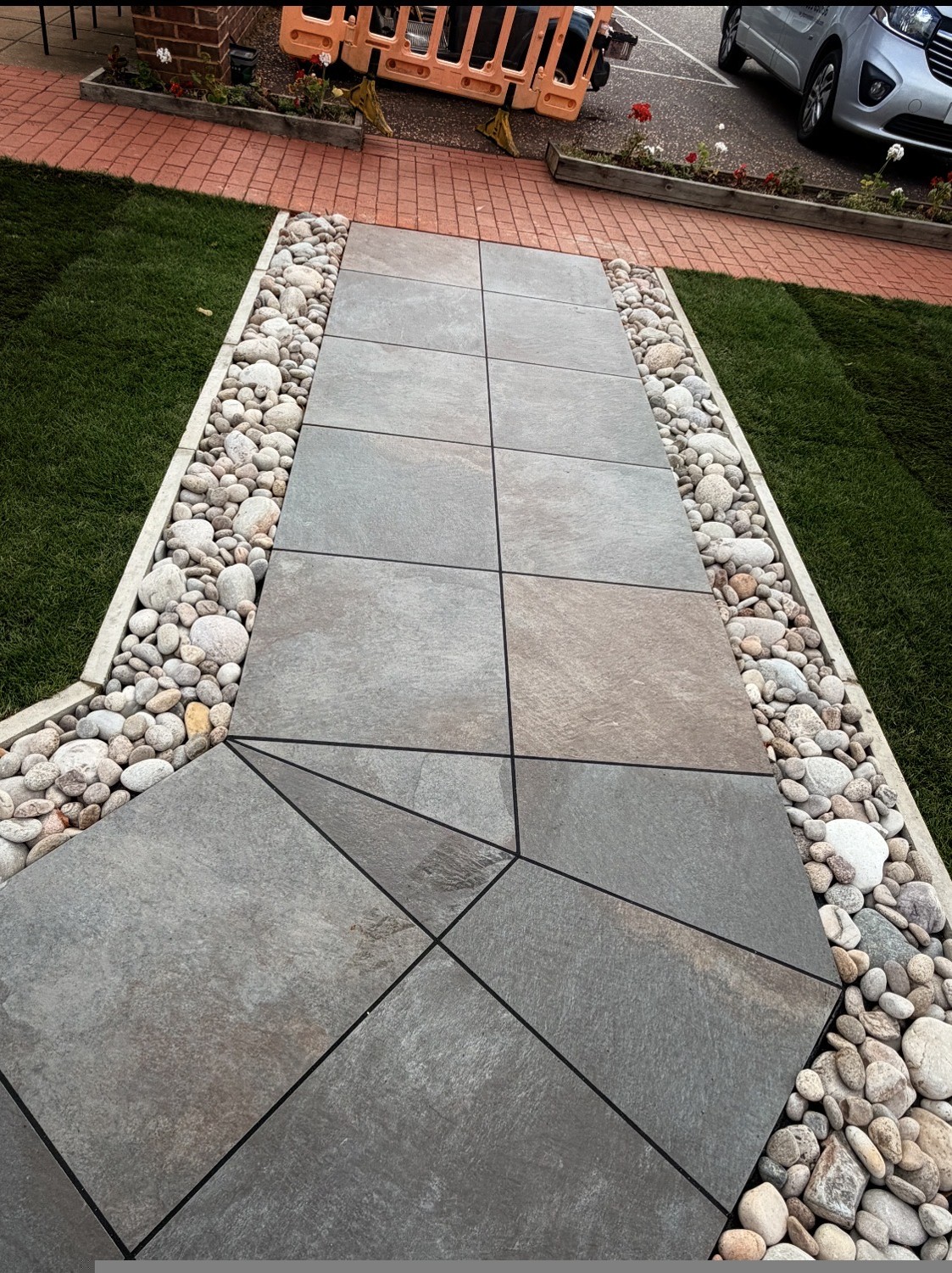 Completed pathway and water fountain project by AW Landscaping